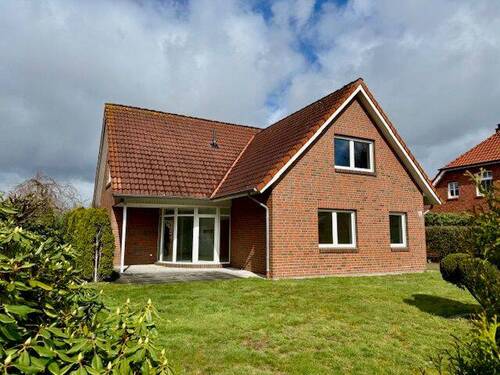 653 Titelbild - Familienfreundliches Einfamilienhaus von 1993 - mit Weitblick ins Grüne in Hollwege.