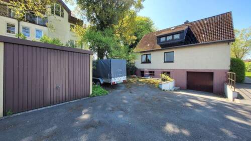 Haus von hinten mit Garagen - Einfamilienhaus mit 104,00 m² in Kaltenkirchen zum Kaufen