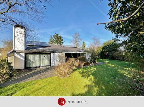 Haus zu verkaufen in Stuhr Kuhlen – H & T Immobilien - Großzügiger Bungalow mit Pool, Sauna und Doppelgarage!