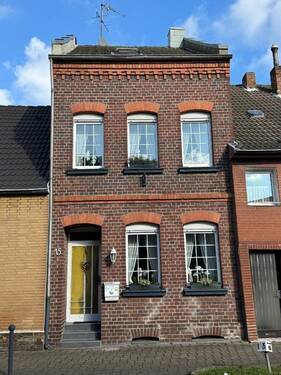 Straßenansicht - Gepflegtes Reihenmittelhaus in Jüchen-Bedburdyck zu verkaufen!