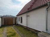 Garagenzufahrt - Einfamilienhaus mit 92,00 m&sup2; in Elsteraue zum Kaufen