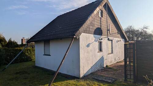 Ansicht von hinten - Mehrfamilienhaus, Wohnhaus mit 35,00 m&sup2; in Zetel zum Kaufen