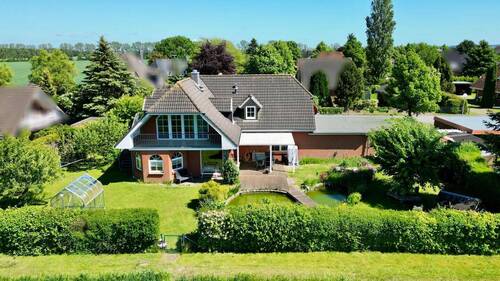 rückwärtige Gebäudeansicht - 6 Zimmer Mehrfamilienhaus, Wohnhaus zum Kaufen in Wittenbeck