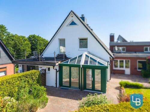 Blick auf den Wintergarten und die Dachterrasse - 