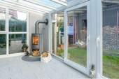 Wintergarten mit Holzofen - 