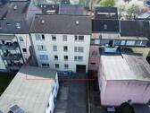 Luftbild Rückseite - Mehrfamilienhaus, Wohnhaus in Oberhausen zum Kaufen