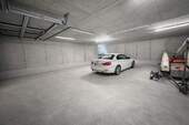 Alpen-Immo - Private Tiefgarage mit Rolltor auf 112m² - Raum für bis zu 3 Fahrzeuge - Strom und Wasseranschluss