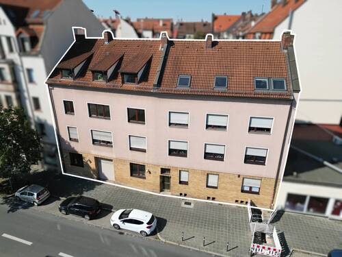 Ostansicht - Vermietete Gewerbeeinheit mit hohen Decken, offener Fläche und Terrasse