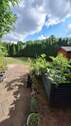 Garten mit Hochbeet - 