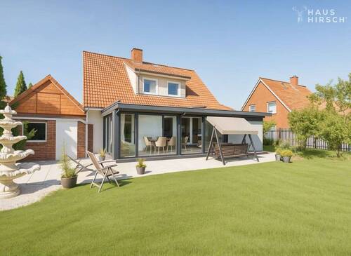 Gartenansicht - Gepflegter Familientraum mit großem Wintergarten und Südgarten