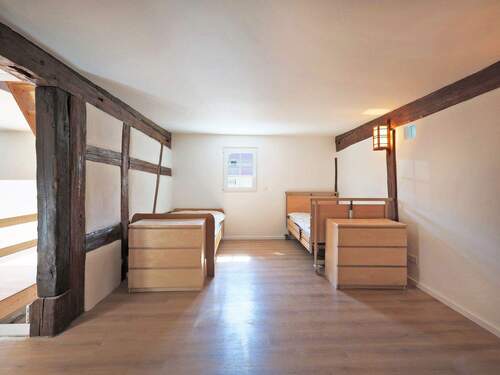 Schlafzimmer mit charmanten Fachwerkdetails - 