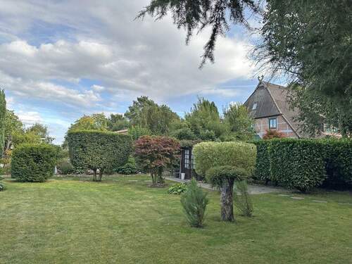 Eckdaten Garten mit Blick auf das Haus - 2 Zimmer Etagenwohnung in Dassendorf