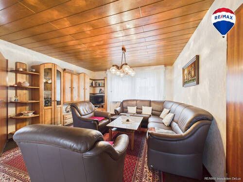 RE/MAX Immobilien DeLux Wohnzimmeransicht 2 - 