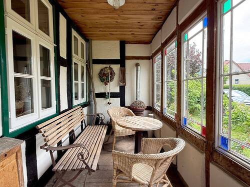 Vorbau mit Ofen - 4 Zimmer Einfamilienhaus in Bad Essen