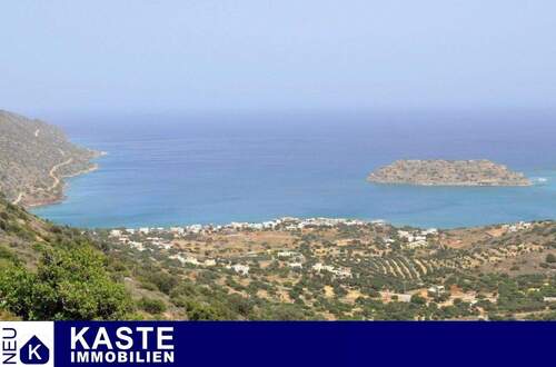 Titel - Baugrundstück mit Blick auf das Meer und Baugenehmigung in Elounda auf Kreta.