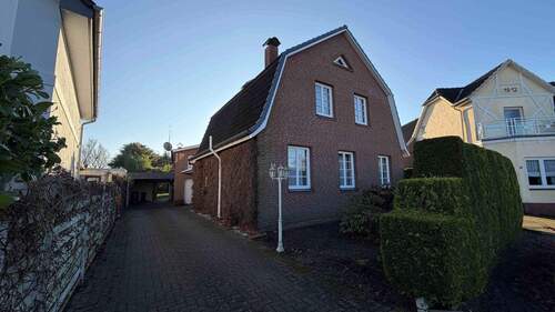 Ansicht - Viel Potenzial in Tornesch! Einfamilienhaus mit Teilkeller und Garage