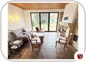 Wohnzimmer - gartenseitig - mit Kamin und Zugang zur Terrasse - 