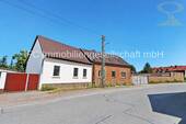 Hausansicht / Straßenseite - Vielseitige Wohn- und Gewerbeimmobilie in Dessau OT Mildensee - Wohnhaus, Büros, Hallen u. Werkstatt