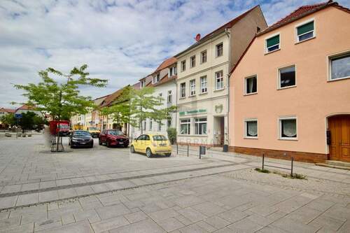 Bild 1 - Vermietetes Wohn-und Geschäftshaus