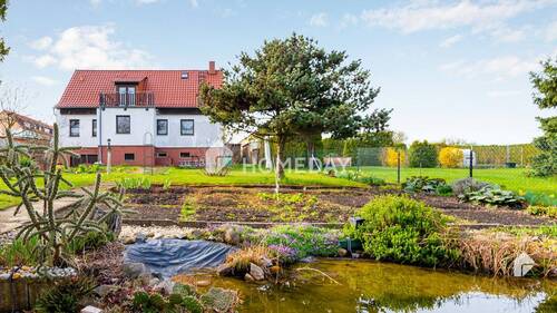 Außenansicht 5 - Wohnen mit Gartenidylle - freistehendes EFH mit Wellnessbad & großzügigem Raumangebot in Seenähe