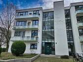 Blick auf Eingang zur Wohnanlage - Etagenwohnung mit 92,00 m&sup2; in München zum Kaufen