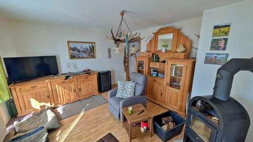 Wohzimmer mit Kaminofen - 