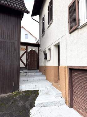 Durchgang zur Terrasse, Scheune - Mehrfamilienhaus, Wohnhaus mit 233,00 m&sup2; in Birkenfeld zum Kaufen