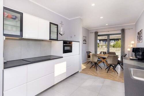 4. Die offene Küche als mittigen Raumteiler - 