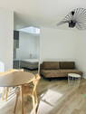 Wohnbereich mit Schlafsofa - 1 Zimmer Terrassenwohnung zur Miete in Frankfurt am Main