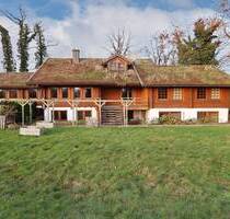 Besonderes Holzhaus mit Wohnung und großzügigem Nebengebäude in idyllischer Lage - Steinfeld Harpendorf