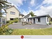 H&T Immobilien - Einfamilienhaus in Stuhr - Wohnen mit Gartenidylle und vielen Optionen