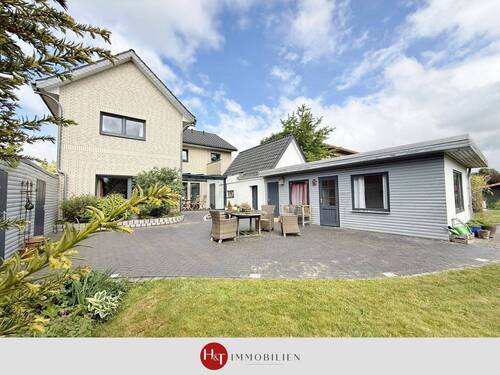 H&T Immobilien - Einfamilienhaus in Stuhr - Wohnen mit Gartenidylle und vielen Optionen