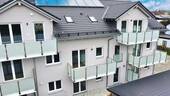 Ansicht MFH - Moderne Neubau-Dachgeschosswohnung mit großem Balkon und lichtdurchflutetem Wohnbereich
