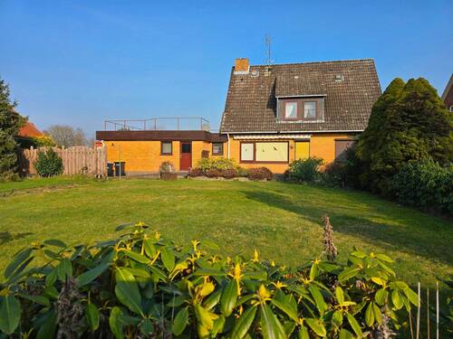 Rückseite des Hauses - Gepflegtes Einfamilienhaus im Zentrum von Bleckede mit Garage, Nebengebäude und Garten