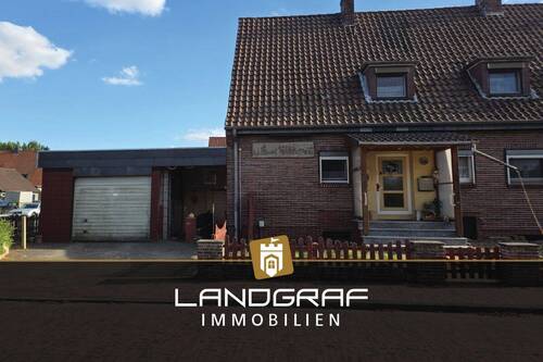 Ansicht - Charmante Doppelhaushälfte mit Potenzial – Renovierungsbedürftig, auf tollem Endgrundstück mit Keller und Carport!