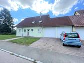 Gebäudeansicht - Gepflegte und helle Erdgeschosswohnung inkl. moderner EBK und Garage sowie Gemeinschaftsgarten