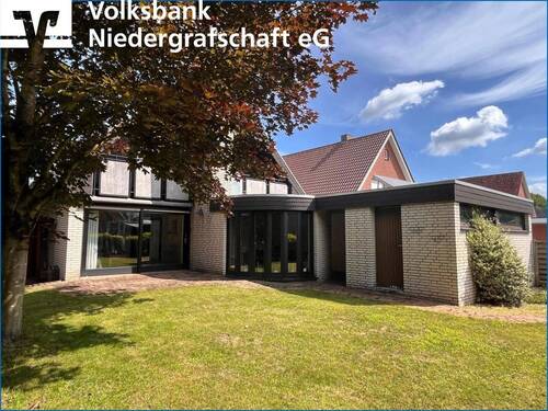 Rückwärtige Ansicht - Einfamilienhaus in Georgsdorf - 235.000,00 EUR Kaufpreis, ca.  121,00 m² Wohnfläche