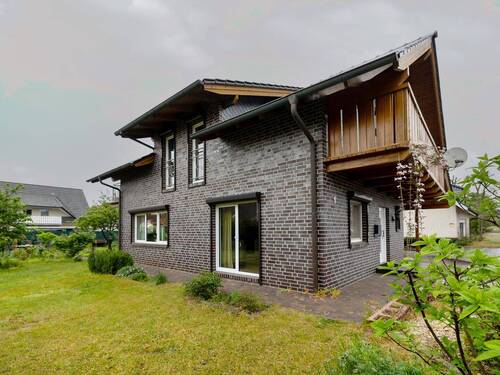 Seitenansicht - Einfamilienhaus mit 118,90 m&sup2; in Diepholz zum Kaufen