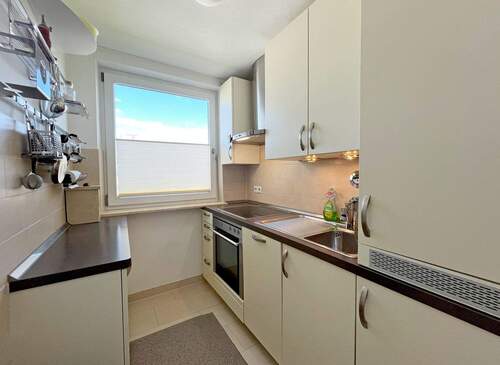 Küche mit Einbauküche - Etagenwohnung mit 47,60 m² in München zum Kaufen
