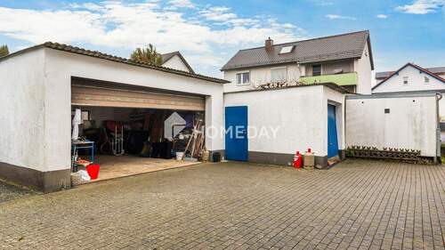 Garage 1 - 7 Zimmer Einfamilienhaus zum Kaufen in Schauenburg