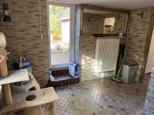 Durchgangszimmer mit Zugang in den Garten - 