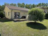 Garten mit Baum und Terrasse - Urlaubsfeeling in deinem Ferienhaus am Geiseltalsee