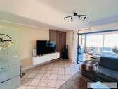 Ihr gemütliches Wohnzimmer mit Zugang zur Loggia + zum offenen Esszimmer + Küche - Reihenmittelhaus mit 90,00 m² in Werl zum Kaufen