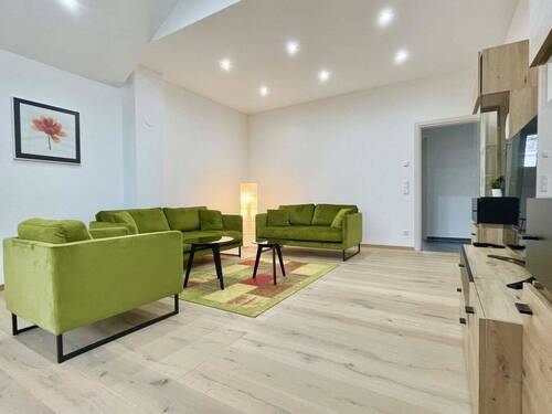 Wohnzimmer - Etagenwohnung mit 113,30 m² in Büchlberg / Saderreut zum Kaufen