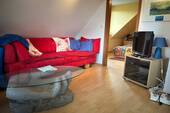Wohnzimmer - Etagenwohnung in Butjadingen zum Kaufen