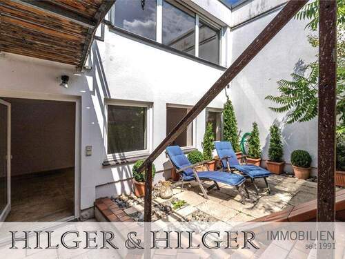 Istzustand: Blick Outdoorbereich UG-Ebene - Bungalow mit 194,00 m² in München zum Kaufen