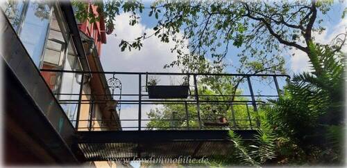 Der Blick zum Übergang Wintergarten - Garten - 