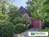 Nordwestansicht - Handwerker aufgepasst! Einfamilienhaus mit Potenzial und großzügigem 1.285 m² Grundstück