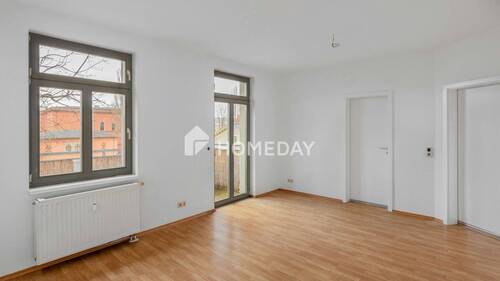 Wohnzimmer 1 - Sofort bezugsfrei: Charmante Dachgeschosswohnung mit Balkon in beliebter Lage