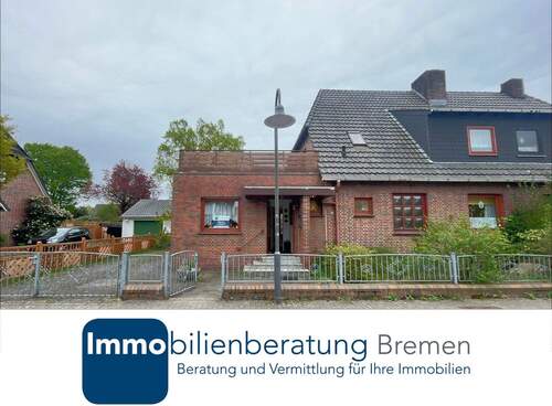Immobilienberatung Bremen GmbH - Doppelhaushälfte mit Anbau und Garage auf großem Grundstück
